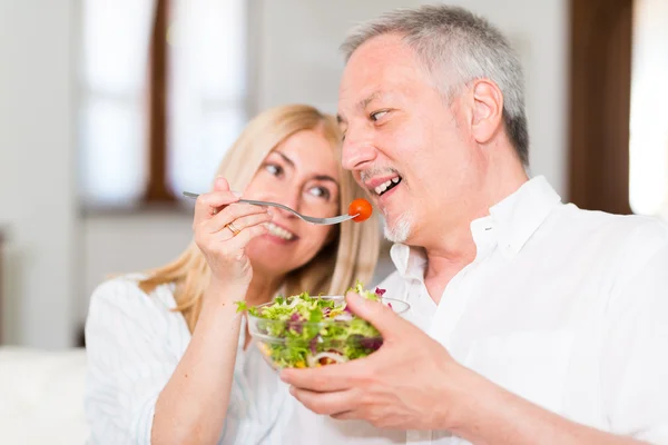 Mature couple eating a salad
