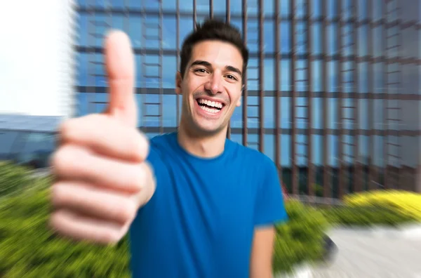 Happy man giving thumbs up