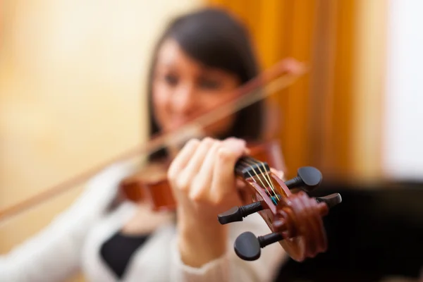 Woman learning to play violin