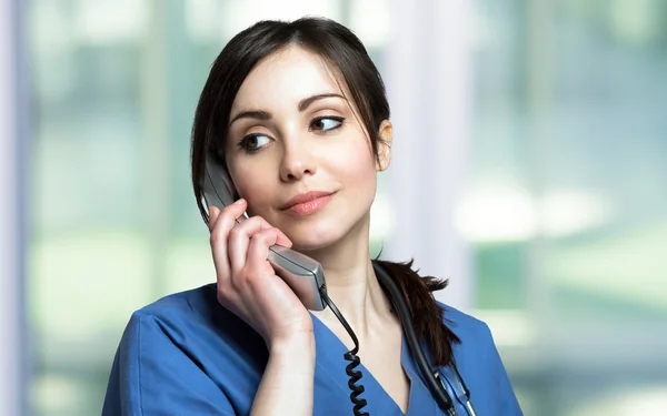 Female nurse talking on the phone