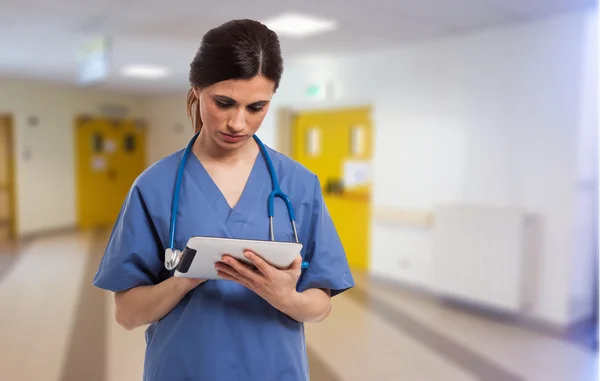 Nurse using a digital tablet