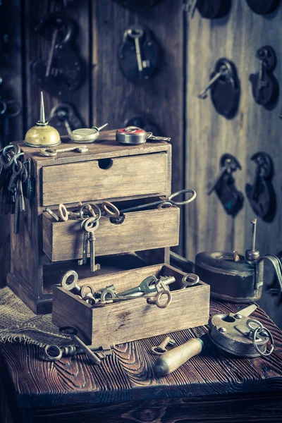 Aged locksmiths workshop with ancient tools