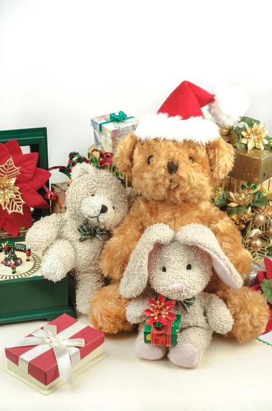 Christmas teddy bear with gifts and friends
