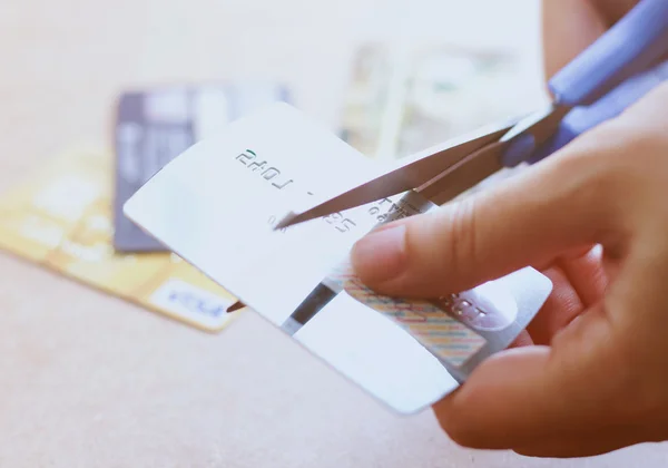 Hand cutting credit card