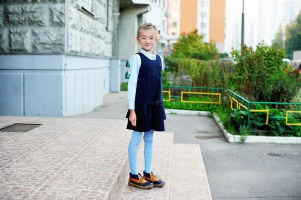 School girl in navy blue uniform outdoor