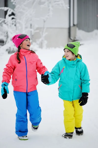 Two kid girls in winter park