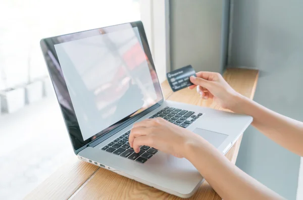 Person holding credit card