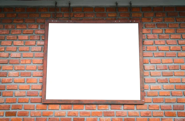 Blank wood sign on brick wall