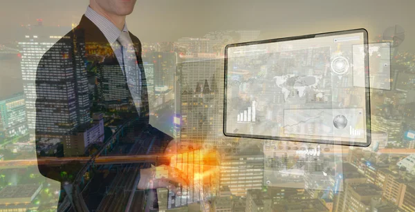 Double exposure of businessman using touch screen device with ci