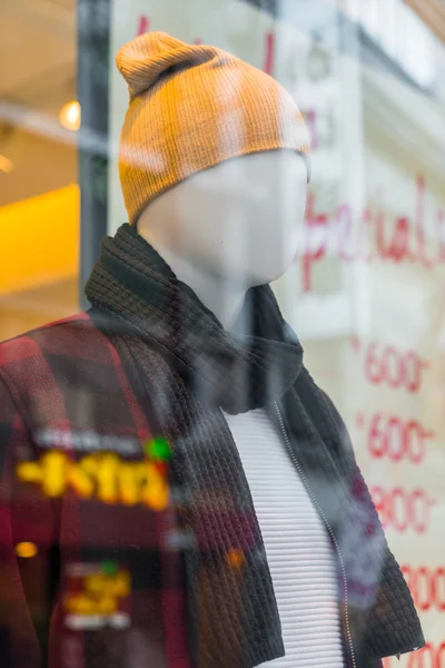 Man dressed mannequins  In Fashion Shop .