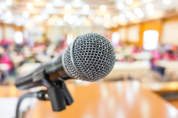 Black microphone in conference room .