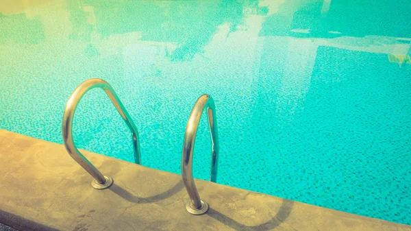 Swimming pool with stairs . ( Filtered image processed vintage e