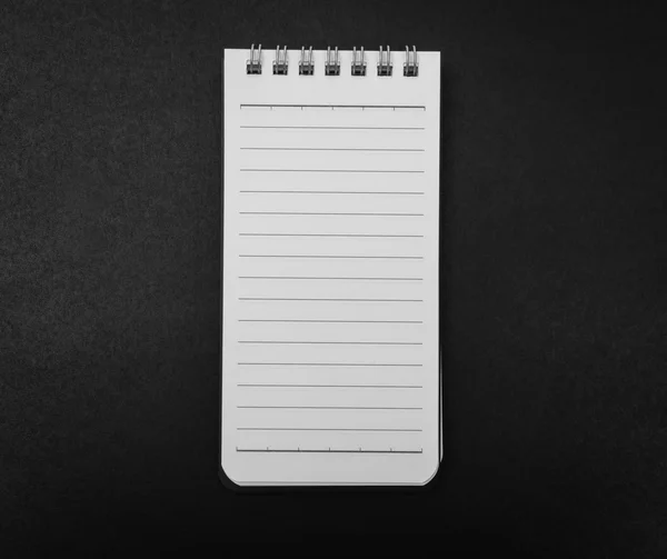 Blank Note book mock up on black background .