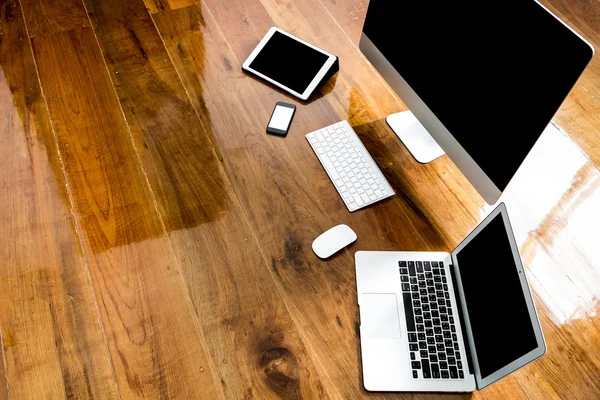 Computer ,laptop , tablet , smart phone on wood table  ( with 4