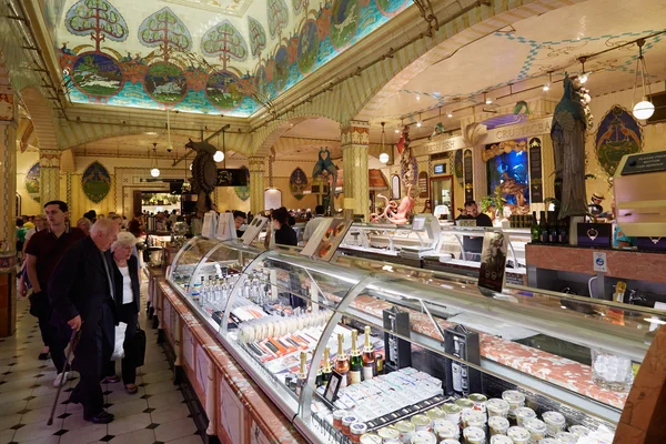 Harrods department store interior, food area with people in London