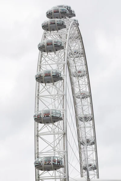 London eye, ferris wheel, cabins detail on a cloudy sky, London