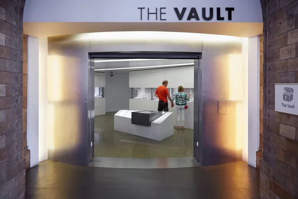 The vault in Natural History Museum interior with people in London