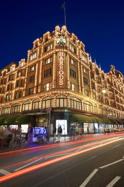 The famous Harrods department store illuminated at night in London