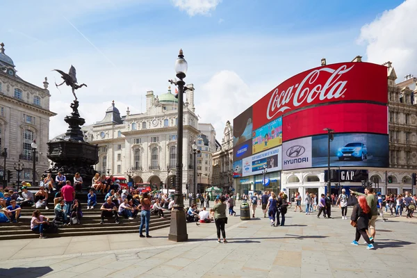 Famous Piccadilly Circus neon signage and Eros fountain with people