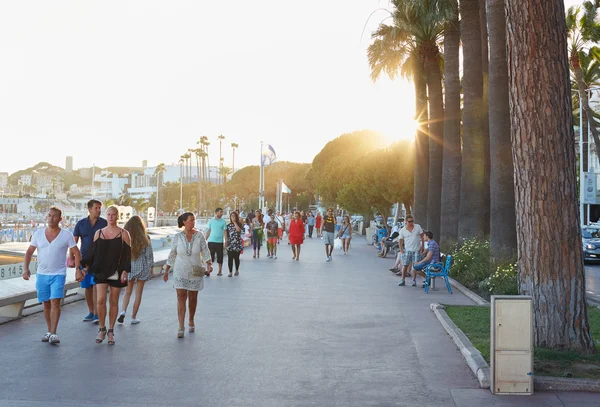 People walking in a summer afternoon along the Croisette, Cannes