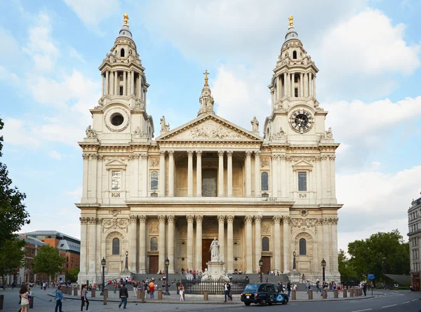 St Paul\'s cathedral facade with people in London