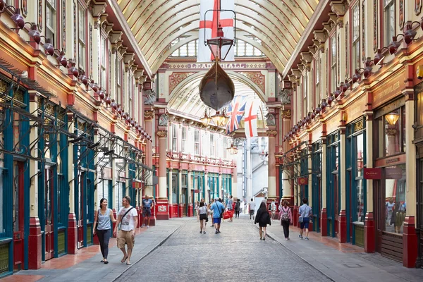 Leadenhall covered market interior, people walking in summer in London