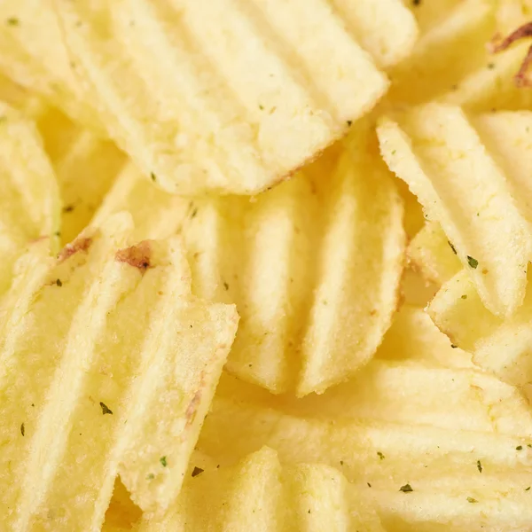 Surface covered with multiple potato chips