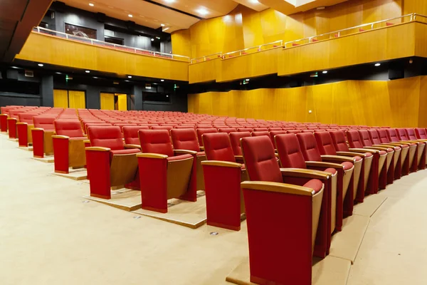 Red chairs in cinema room