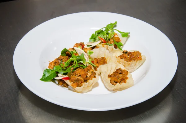 Stir-fried pork and basil) in mini basket. Thai cuisine.