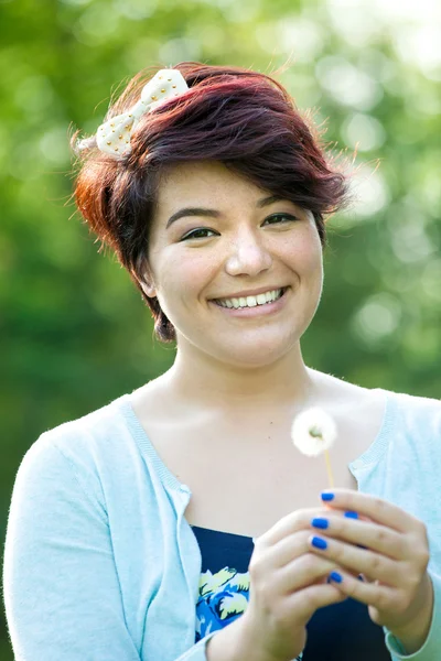 Woman Holding a Dried Dandelion