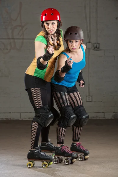 Roller Derby Skaters in Pointing Finger