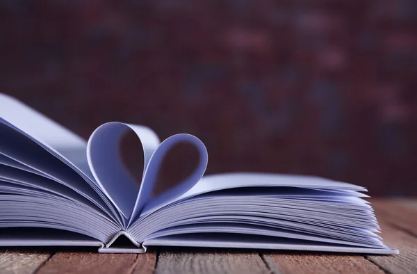 Sheets of book curved into heart shape