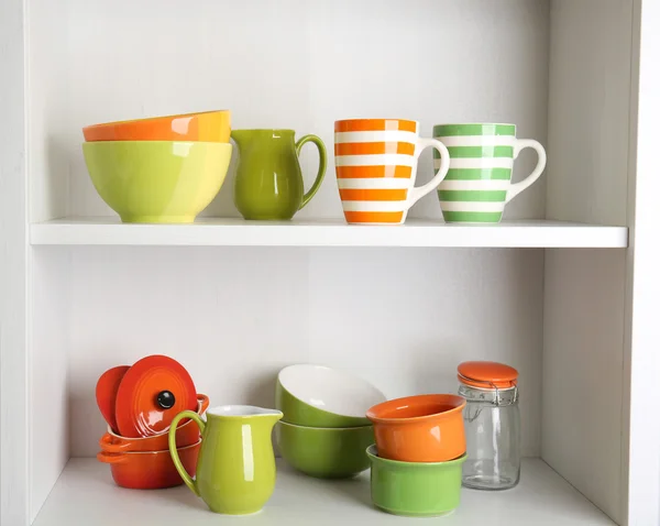 Tableware on shelves in the kitchen