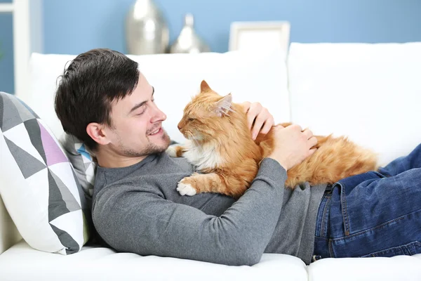 Man with fluffy cat
