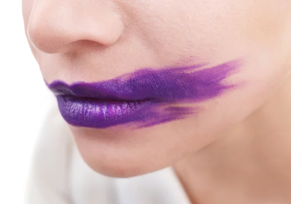 Woman\'s face with smeared  lipstick