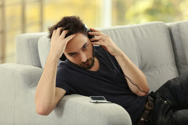 Man listens music with headphones