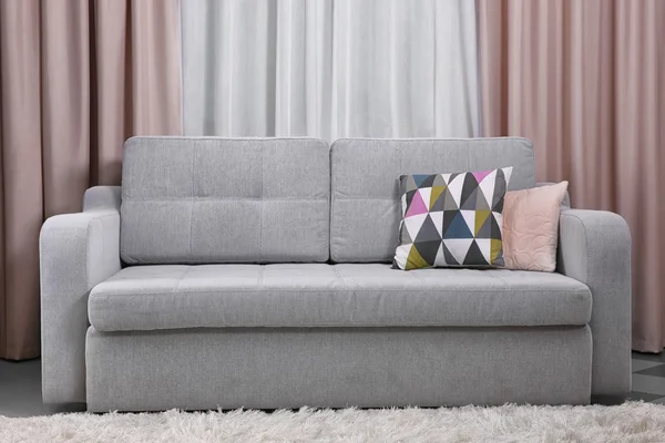 Grey sofa in the room