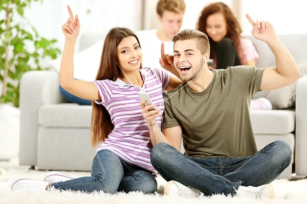 Teenager couple listening to music