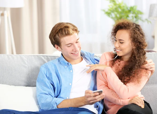 Teenager couple listening to music