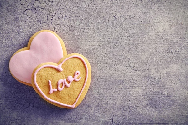 Pink love cookies on grey background, copy space