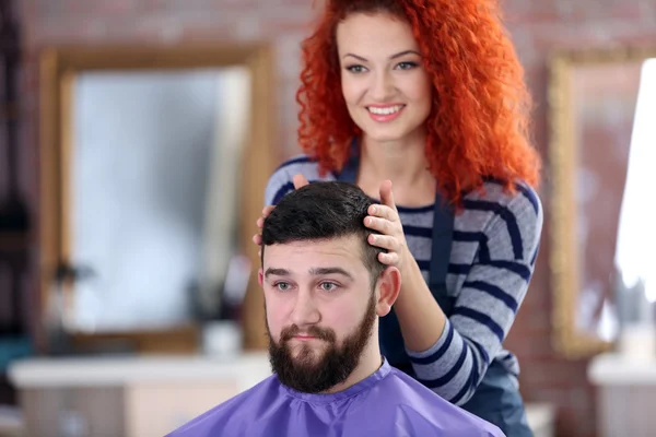 Professional hairdresser making new haircut