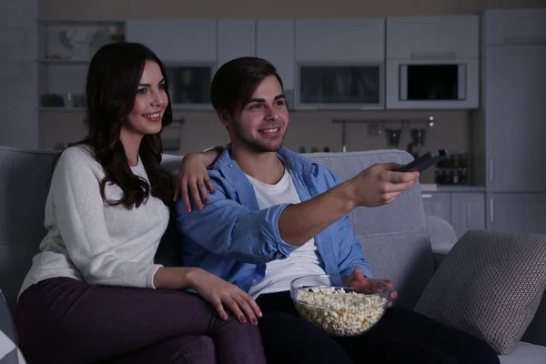 Young couple watching TV