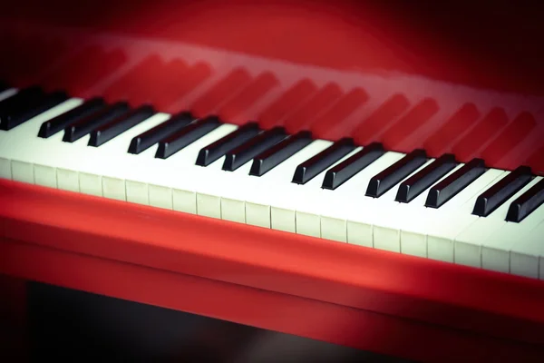 Piano keys of red piano