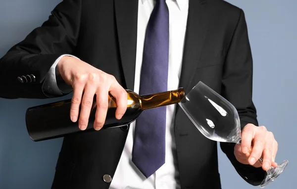 Man pouring red wine