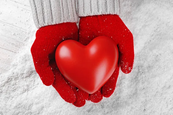 Hands in warm red gloves