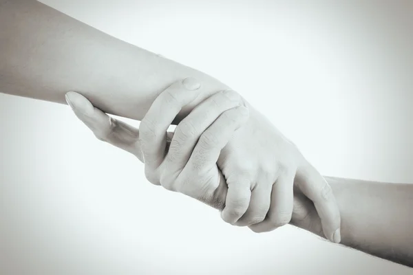 Hands reaching toward each other