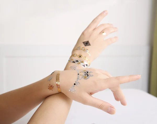 Flash tattoo on female hands