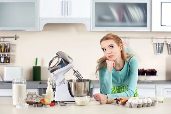 Young woman using a food processor