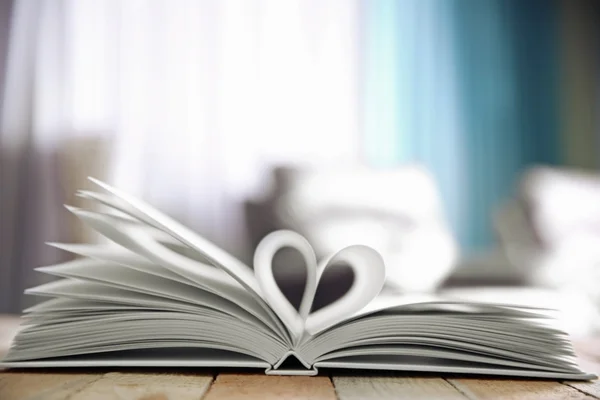 Sheets of book curved into heart shape