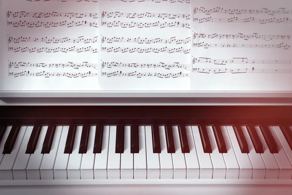 Piano keyboard and musical notes